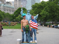 boys posing with statue of liberty